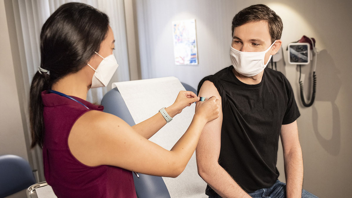 Healthcare professional administering a vaccine